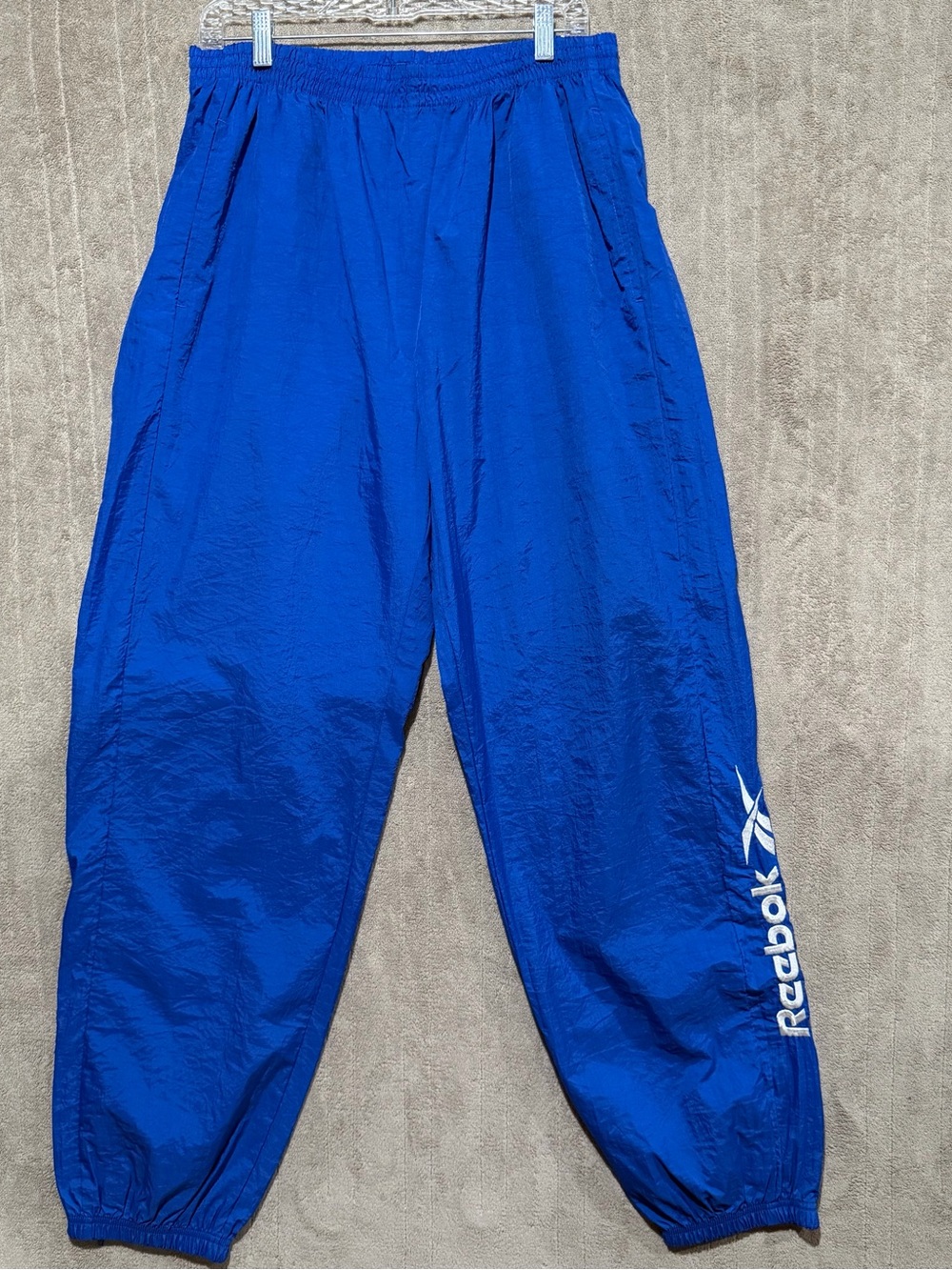Vintage 90s Reebok Mens XL Blue White Spell Out Logo Leg Nylon Windbreaker Pants